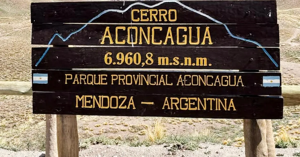 The wooden park sign reading Cerro Aconcagua 6.960,8 m.s.n.m., Parque Provincial Aconcagua, Mendoza, Argentina